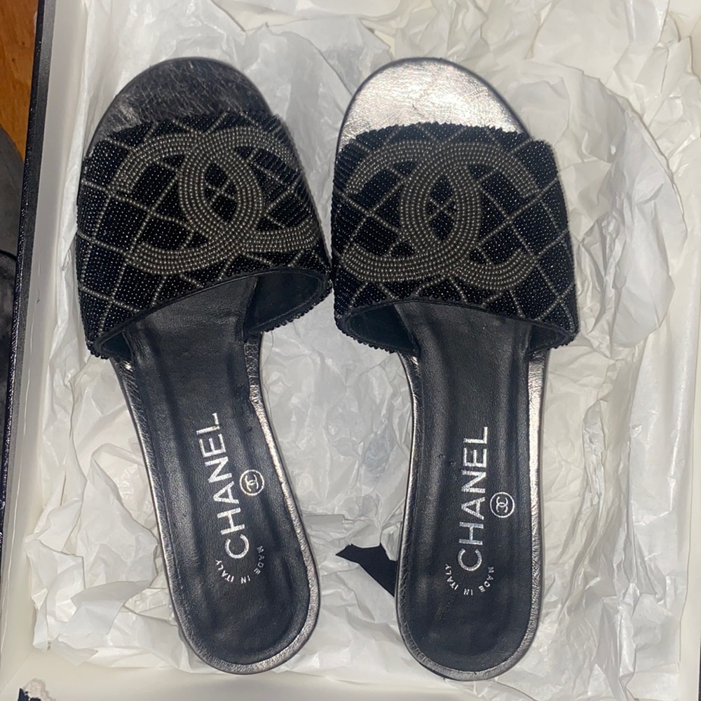 Black and silver Chanel slides